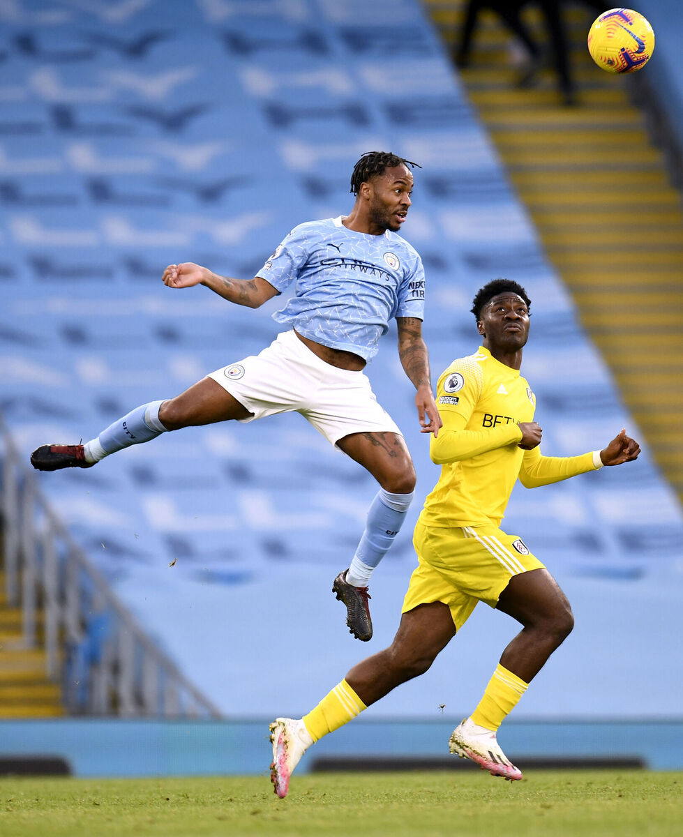 Manchester City's Raheem Sterling (left) and Fulham's Ola Aina battle for the ball. Picture: Peter Powell/PA 