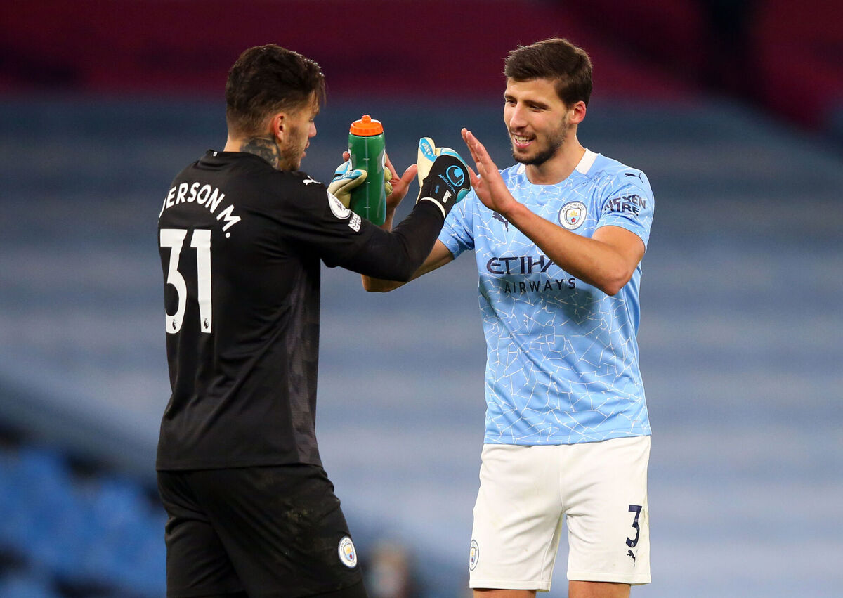 Manchester City's Ruben Dias (right) and Ederson. Picture: Alex Livesey/PA