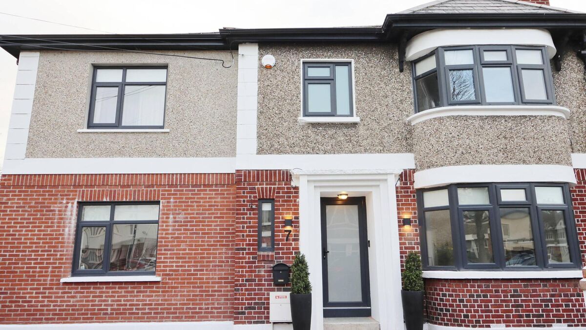 The newly-finished exterior of the house, complete with contemporary slate coloured windows and front door, allows access for Lynchs parents to the side.