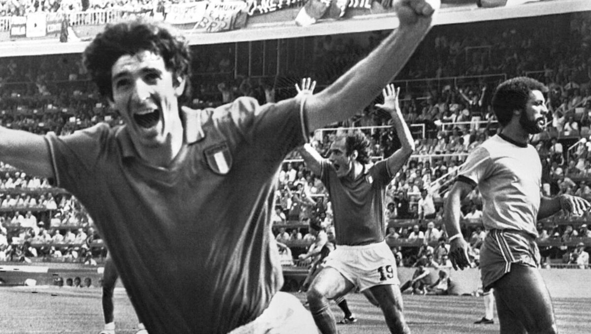 FILE - In this July 5, 1982 file photo, Italy's Paolo Rossi, left, celebrates, after scoring the second goal for his team during their World Cup second round soccer match against Brazil, in Barcelona, Spain. Rossi died of Cancer, Dec. 10, 2020. He was 64. (AP Photo/File)