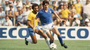 <p>Paolo Rossi of Italy shields the ball from Junior of Brazil during the World Cup Round Two, Group Three match between Brazil and Italy held at the Sarria Stadium, Barcelona, Spain on July 5, 1982. Rossi scored a hat-trick as Italy won the match 3-2. (Photo by Getty Images)</p>