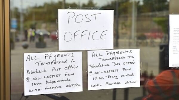 A sign on the window of the Douglas post office in September