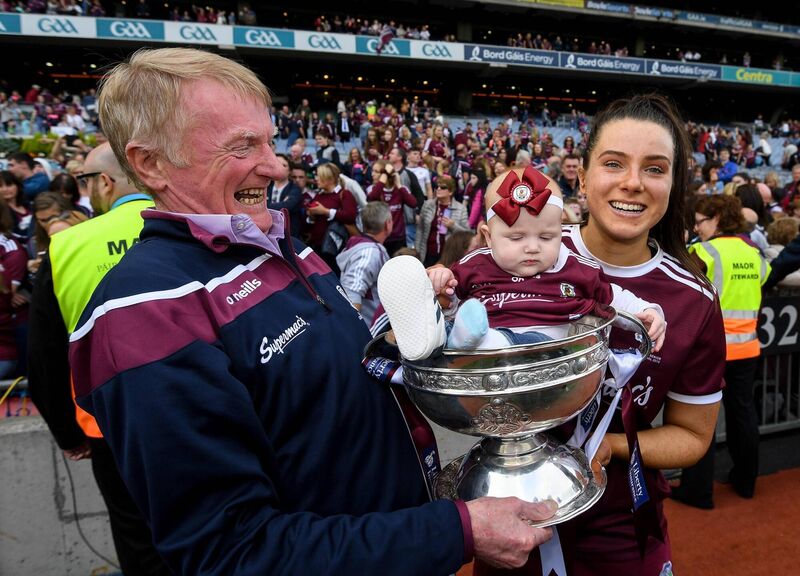 Rebecca Hennelly of Galway with her father Gerry and then seven-month-old following the Liberty Insurance All-Ireland Senior Camogie Championship Final match between Galway and Kilkenny at Croke Park in Dublin. Picture: Ramsey Cardy/Sportsfile Rebecca Hennelly of Galway with her father Gerry and then seven-month-old following the Liberty Insurance All-Ireland Senior Camogie Championship Final match between Galway and Kilkenny at Croke Park in Dublin. Picture: Ramsey Cardy/Sportsfile