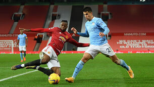 <p>Manchester City's Joao Cancelo (right) and Manchester United's Aaron Wan-Bissaka (left) battle for the ball during the Premier League match at Old Trafford</p>