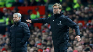 <p>Jose Mourinho, left, and Jurgen Klopp are vying to be first in the Premier League. Picture: Martin Rickett/PA</p>