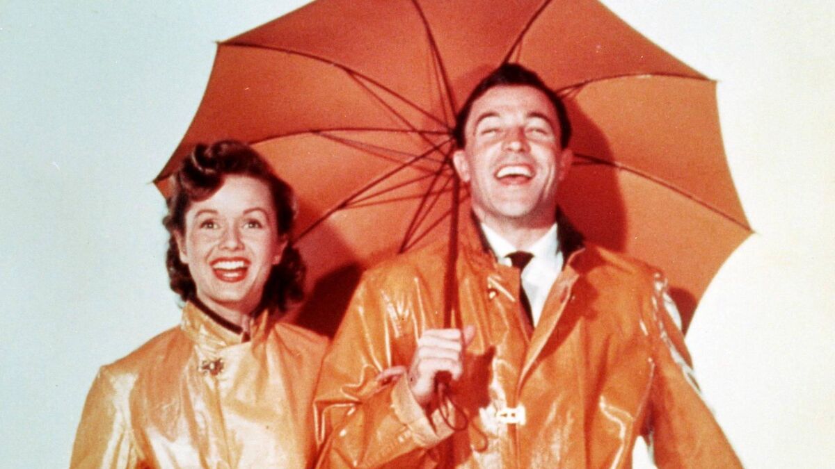  Debbie Reynolds and Gene Kelly  in Singin' in the Rain.