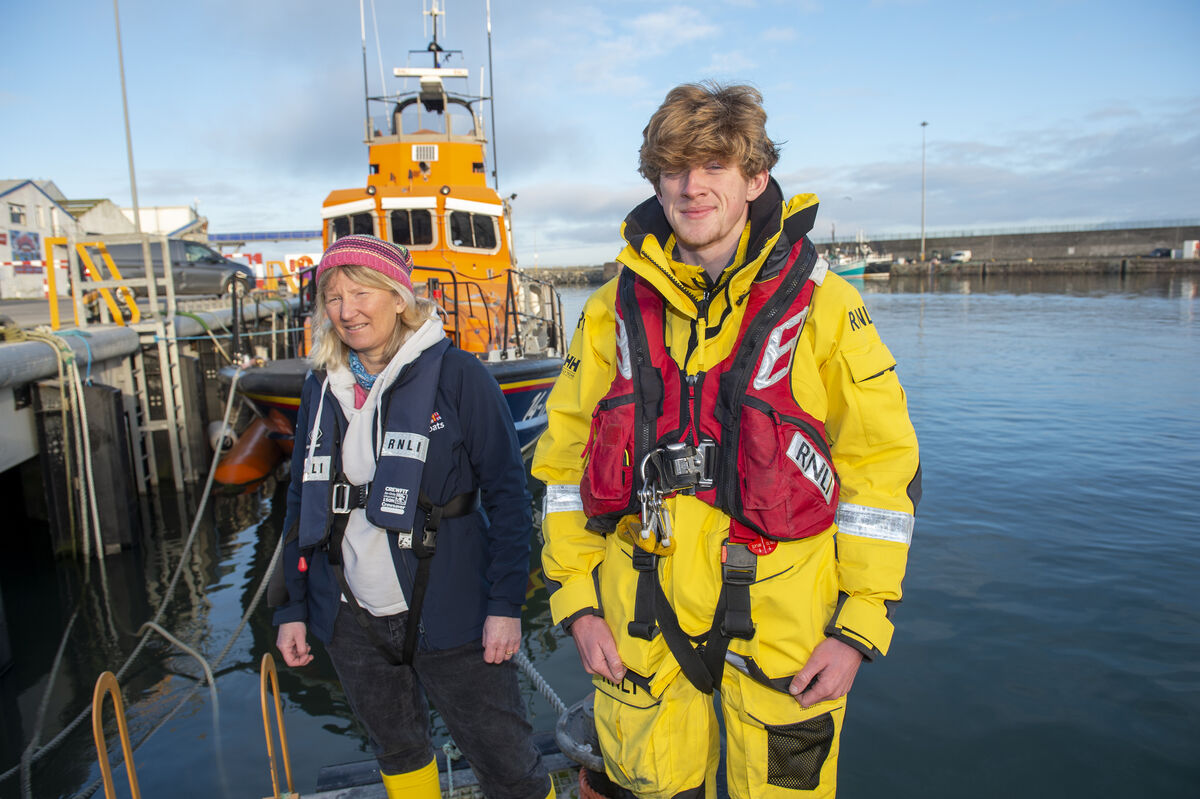 Karen and Luke Sweeney next to the Elizabeth and Ronald lifeboat in the Harbour at Dunmore East, Co Waterford. Picture Dan Linehan