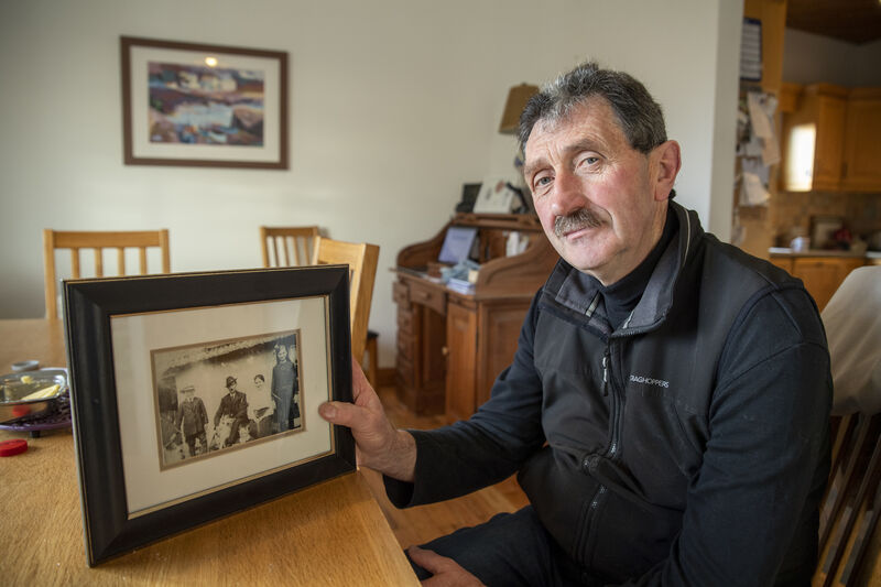 Liam with some of his greyhound memorabilia including an old picture of (from the left) Pat Dowling, grandfather Nicholas Dowling and his wife Mary, Mae Dowling and in front sitting next to the greyhound his father John.