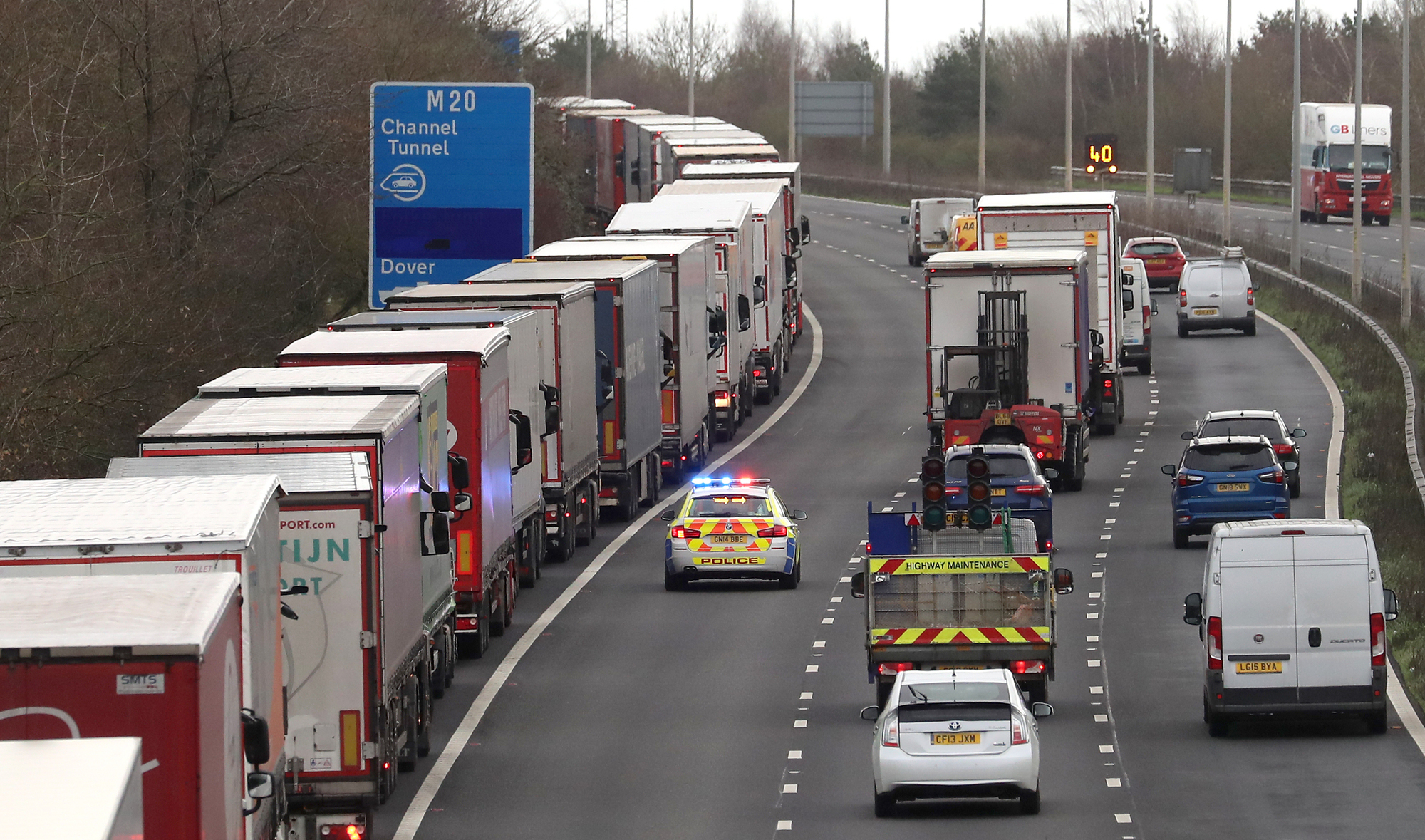 Christmas rush and Brexit uncertainty fuel miles-long lorry queues in UK