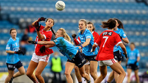 <p>Cork's Eimear Meaney gets a pass away from Carla Rowe of Dublin. Picture: INPHO/Tommy Dickson</p>