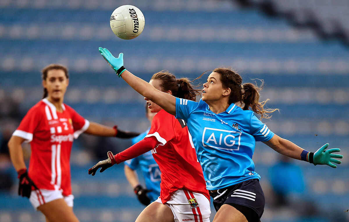 Dublin's Noelle Healy reaches for the ball beside Melissa Duggan of Cork. Picture: INPHO/Tommy Dickson