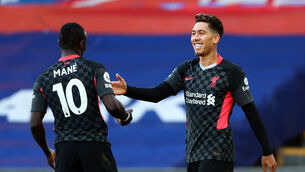<p>Liverpool's Roberto Firmino celebrates scoring his sides third goal with Sadio Mane during the Premier League match at Selhurst Park, London.</p>