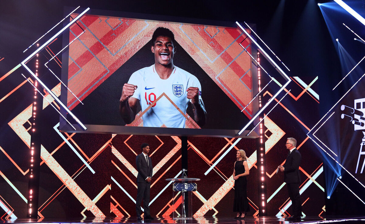 Marcus Rashford (left) is interviewed by Gabby Logan (centre) and Gary Lineker during the BBC Sports Personality of the Year 2020 Picture: Peter Bryne/PA Wire.