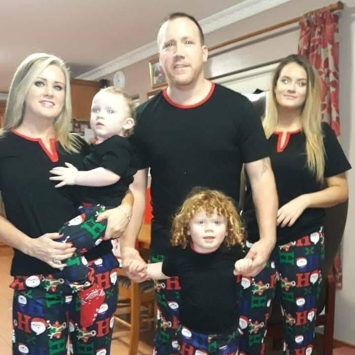 Josephine Feeney with her family. Both her sons are non-verbal and require care 24/7.