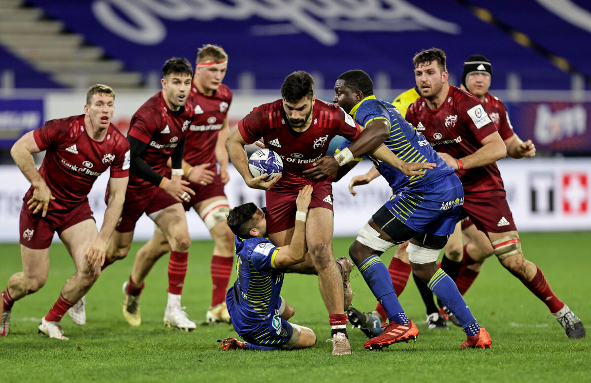 Munster's Damian de Allende is tackled by Sebastien Bezy and Judicael Cancoriet of Clermont Auvergne. Picture: INPHO/Laszlo Geczo