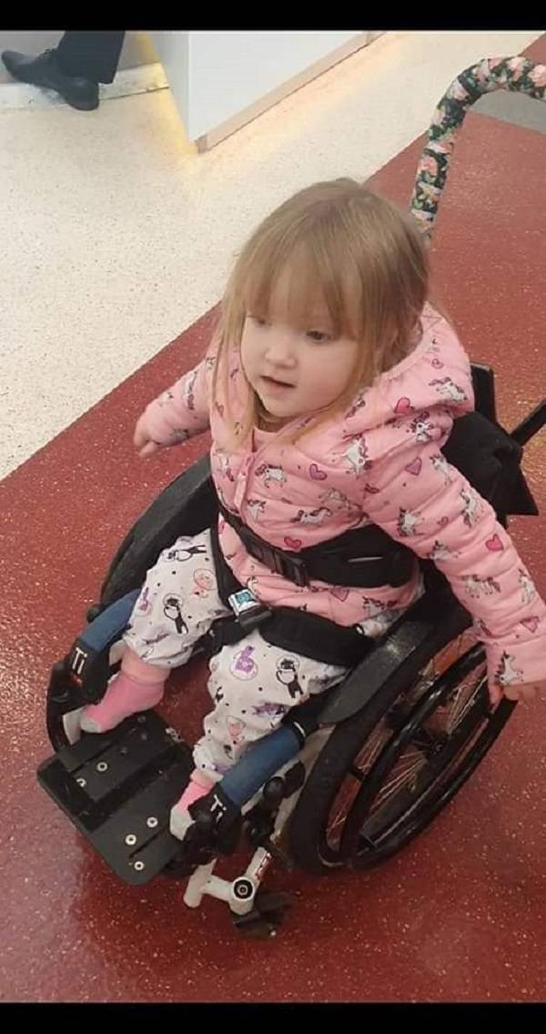 Two-year-old Mia Farrell, who was born with spina bifida and hydrocephalus, is paralysed from the ribs down.