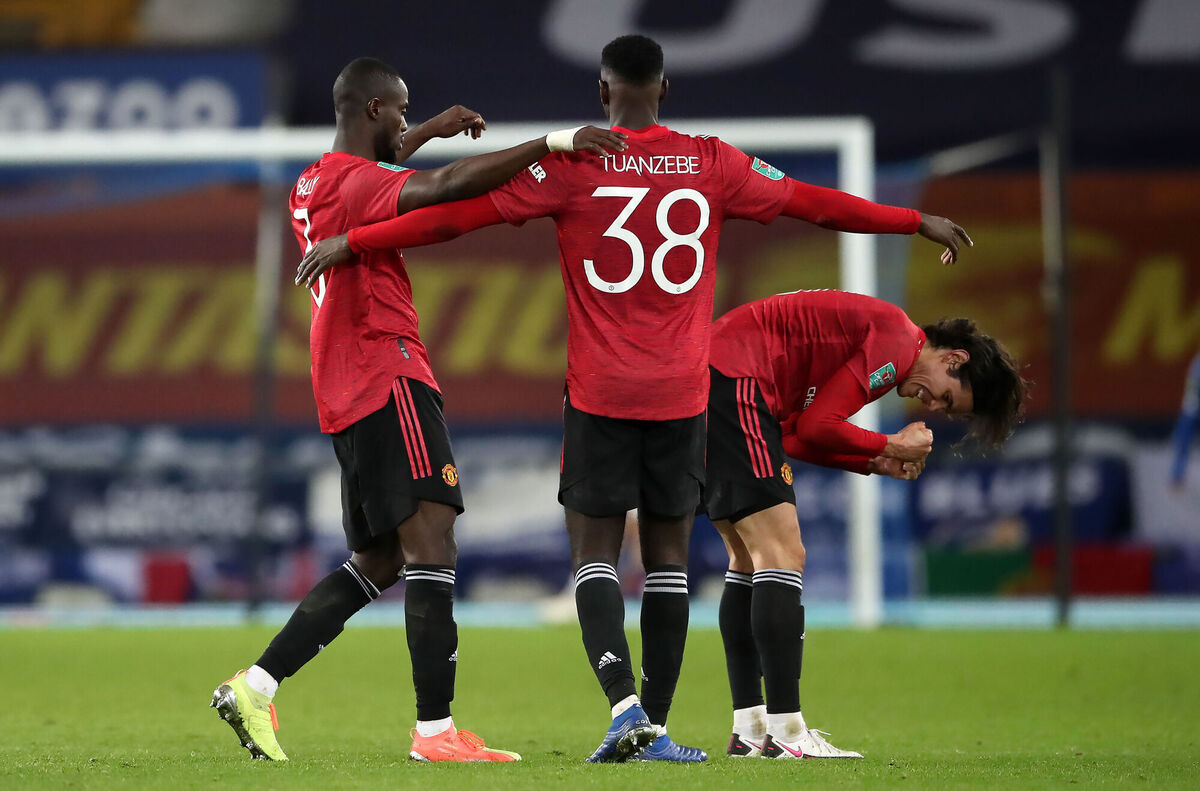 Manchester United's Eric Bailly (left), Axel Tuanzebe (centre) and Edinson Cavani celebrate at the final whistle. Picture: Nick Potts/PA Wire.