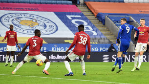 <p>Jamie Vardy’s shot goes in off Axel Tuanzebe to earn Leicester a draw. (Glyn Kirk/PA)</p>