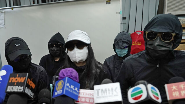 Relatives of a group of Hong Kong activists detained at sea by Chinese authorities attend a press conference on Monday. A Chinese court has sentenced 10 of the activists to prison sentences of up to three years on Wednesday (Kin Cheung/AP)