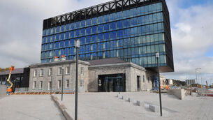 <p>Older structures on Horgan's Quay are folded into new, larger buildings like this modern office block 'sitting' on top of the former 'Goods Shed'. Picture: Larry Cummins</p>