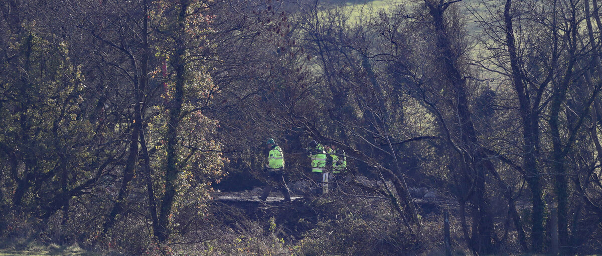 Gardai at the scene on the outskirts of Midleton searching for further remains which may be in the area. Photo: Niall Carson/PA Wire Gardai at the scene on the outskirts of Midleton searching for further remains which may be in the area. Photo: Niall Carson/PA Wire