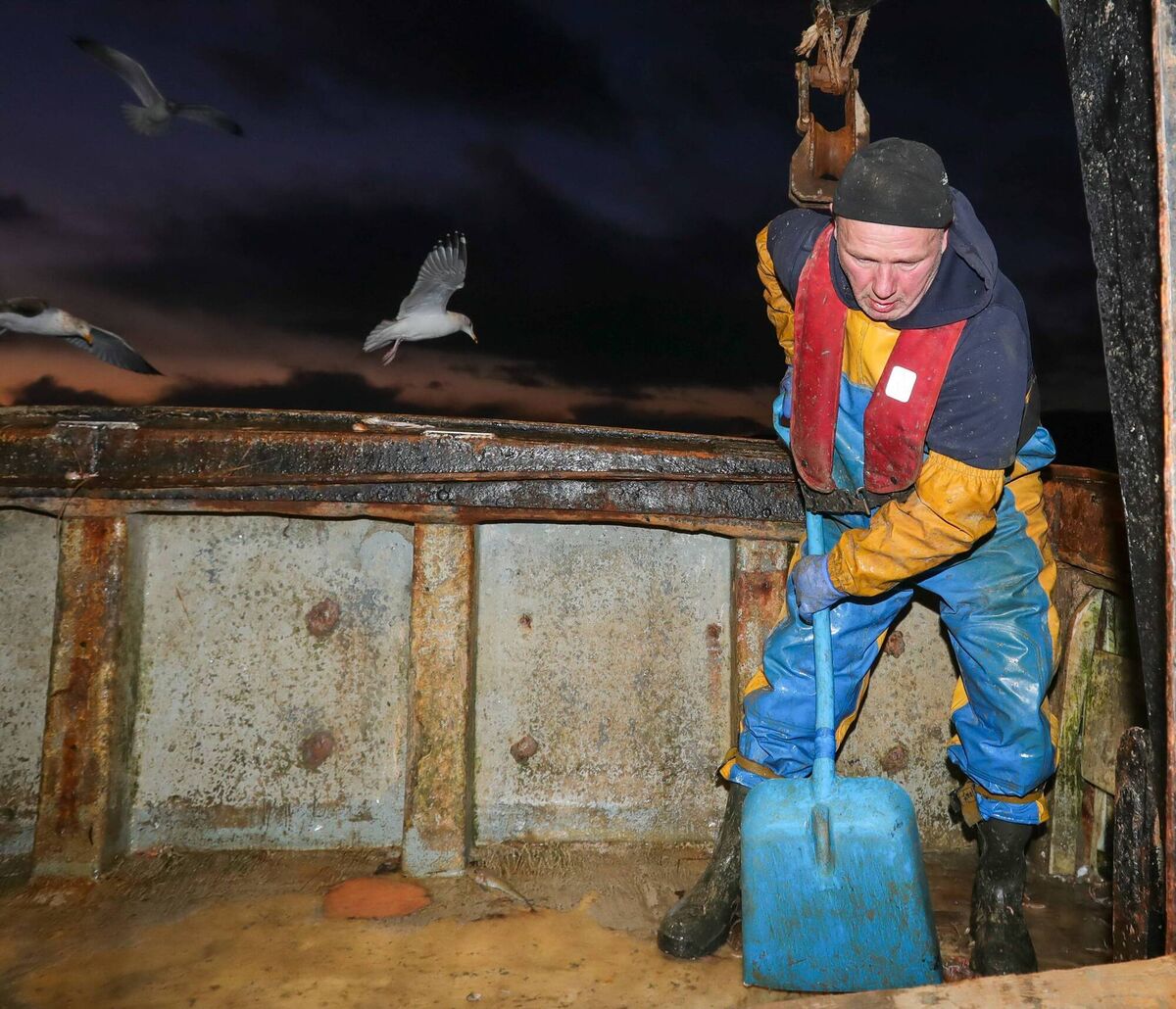 Cleaning up after landing the catch: Lithuanian fisherman Egidijus Maciulskis working on New Year’s Eve aboard the 15-metre trawler La Petite Edelweiss, which is owned by Sean “Bawn” O’Sullivan, from Castletownbere, West Cork. 