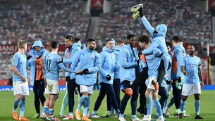 <p>Manchester City players celebrate in a group after the Carabao Cup semi-final win at Old Trafford. Picture: Peter Powell</p>
