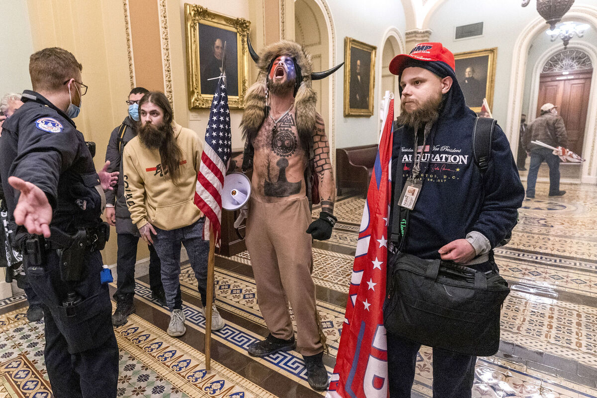 Supporters of President Donald Trump are confronted by Capitol Police officers outside the Senate Chamber inside the Capitol, Wednesday, Jan. 6, 2021 in Washington. Picture: AP Photo/Manuel Balce Ceneta