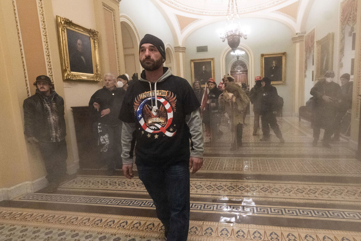 Smoke fills the walkway outside the Senate Chamber as supporters of President Donald Trump are confronted by U.S. Capitol Police officers inside the Capitol, Wednesday, Jan. 6, 2021 in Washington. Picture: AP Photo/Manuel Balce Ceneta