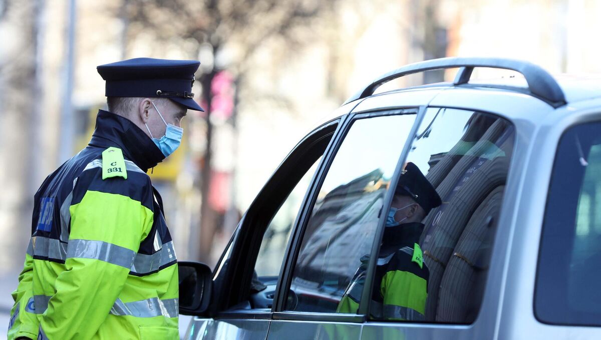 A garda wearing face mask at a checkpoint on O'Connell St in Dublin. Picture: Leah Farrell/RollingNews.ie