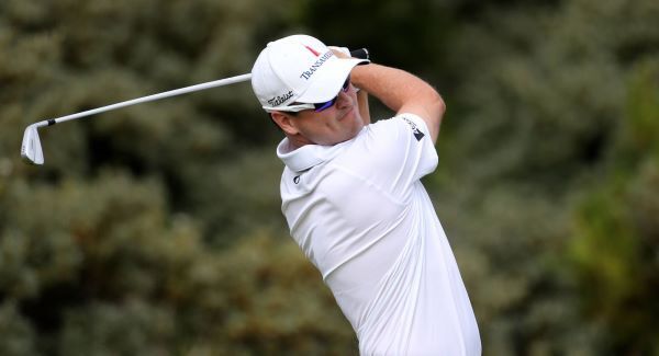 Johnson leads after tough day