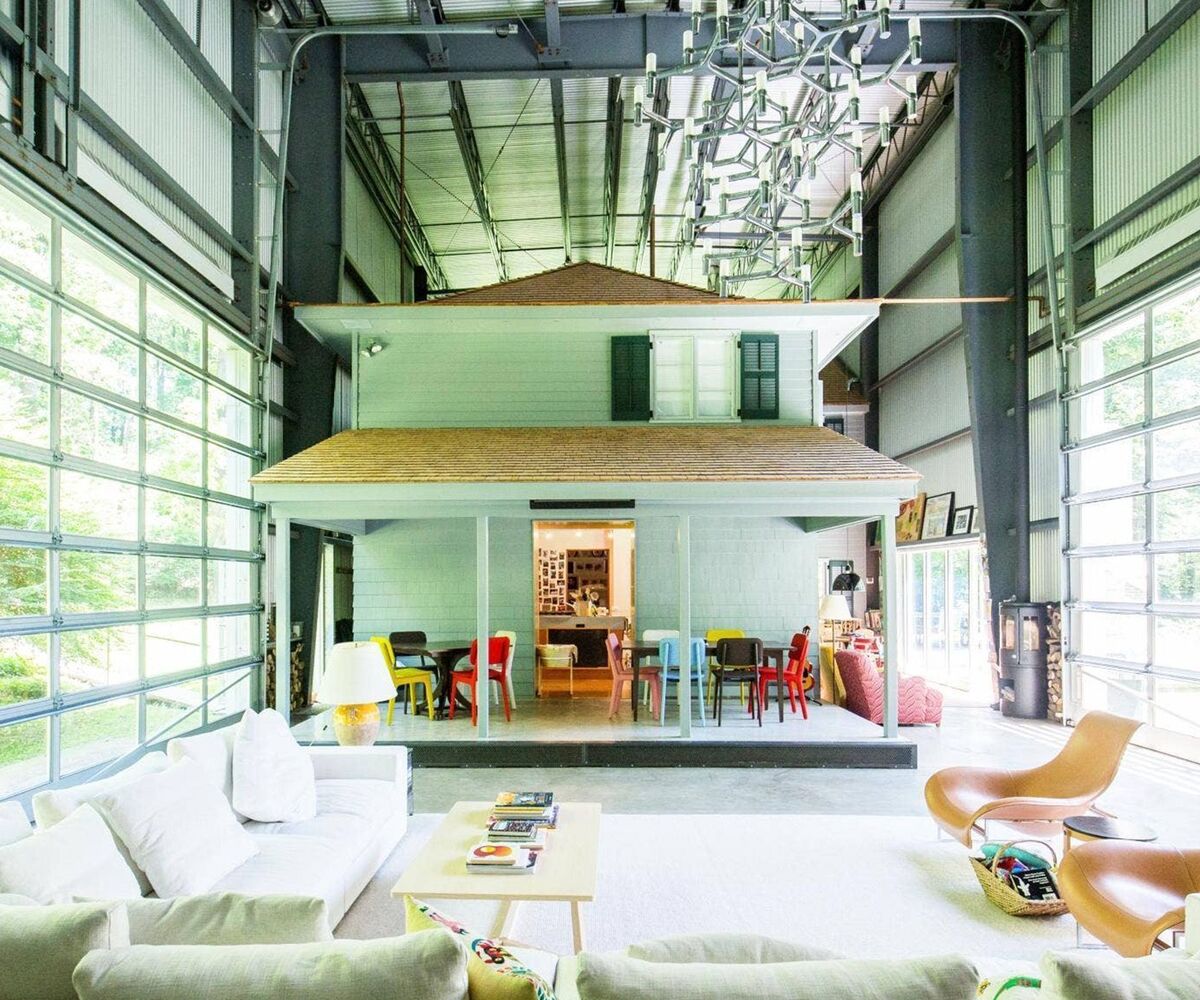 A ship-in-a-bottle approach was taken when a 19th-century New Jersey clapboard house was fitted into an aircraft hangar structure for a young family. A ship-in-a-bottle approach was taken when a 19th-century New Jersey clapboard house was fitted into an aircraft hangar structure for a young family.