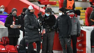 <p>Liverpool manager Jurgen Klopp (left) speaks with the fourth official during the Premier League stalemate with Manchester United. Picture: Paul Ellis</p>