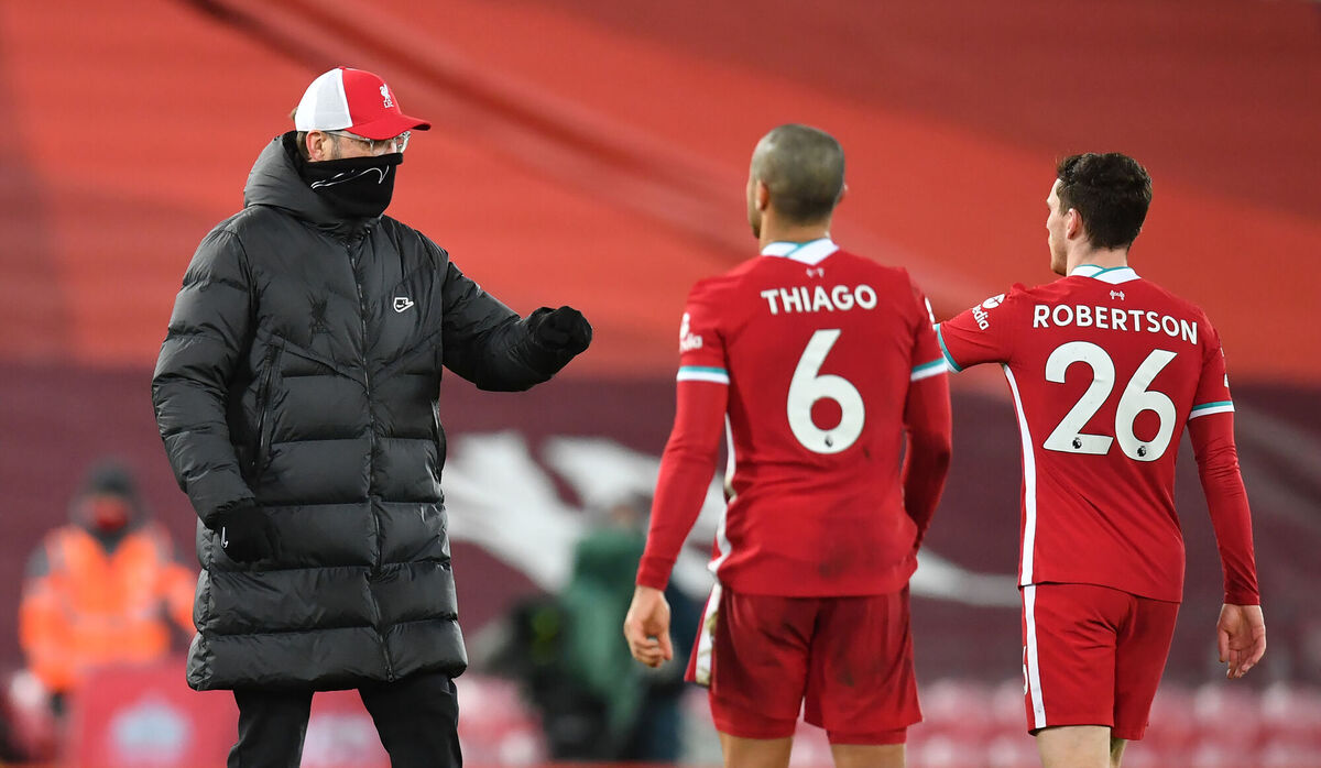 Liverpool manager Jurgen Klopp with Thiago Alcantara (centre) and Andrew Robertson after the game. Picture: Paul Ellis