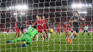 <p>Liverpool's Brazilian goalkeeper Alisson Becker saves a shot from Manchester United's Marcus Rashford. Picture: Michael Regan </p>