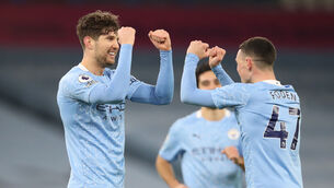 <p>Manchester City's John Stones (left) celebrates scoring his side's third goal of the game with team-mate Phil Foden. Picture: Clive Brunskill</p>