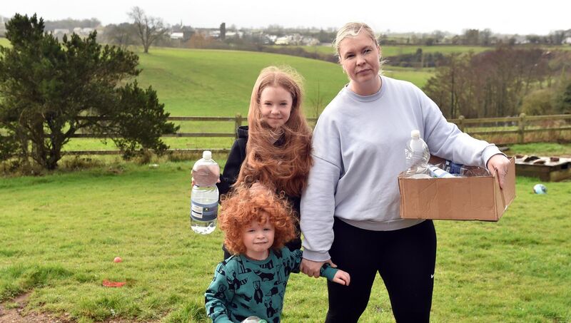 Local resident Anna Gibberd with her children Amber and Harris before heading off to collect water at Glanworth, Co Cork. Picture: Eddie O'Hare