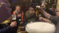 Men pictured drinking pints at UK hotel with caption ‘What Lockdown?’