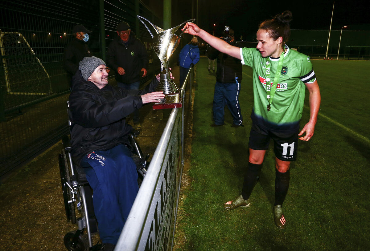 Peamount's Aine O'Gorman presents the FAI Women's National League to Peamount supporter Sean Kirwin. Picture: INPHO/Ken Sutton Peamount's Aine O'Gorman presents the FAI Women's National League to Peamount supporter Sean Kirwin. Picture: INPHO/Ken Sutton