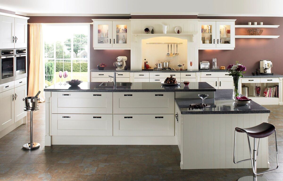 Deep drawers take the place of traditional 60cm cupboards on the island in this sleek blend of traditional and new in handled white cabinets by Right Price Kitchens, rightpricekitchens.ie