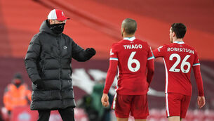 <p>Liverpool manager Jurgen Klopp with Thiago Alcantara (centre) and Andrew Robertson after the Premier League draw against Manchester United. Picture: Paul Ellis</p>