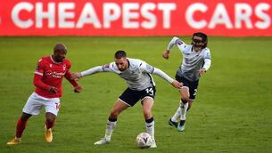 <p>Swansea City's Conor Hourihane holds off Nottingham Forest's Fouad Bachirou at the Liberty Stadium. Photo: Simon Galloway/PA</p>