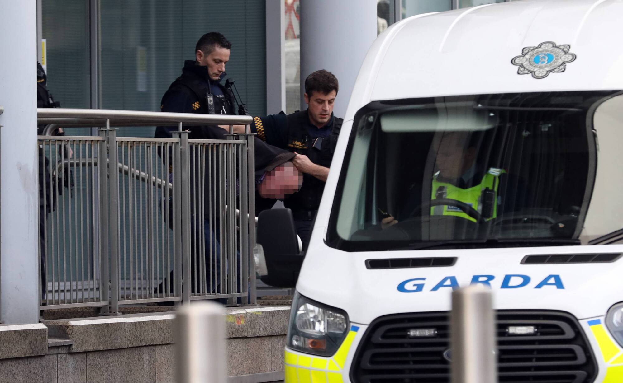 Gardaí removing a man from the courthouse in Smithfield, Dublin, on the day of the incident. Photo: Collins