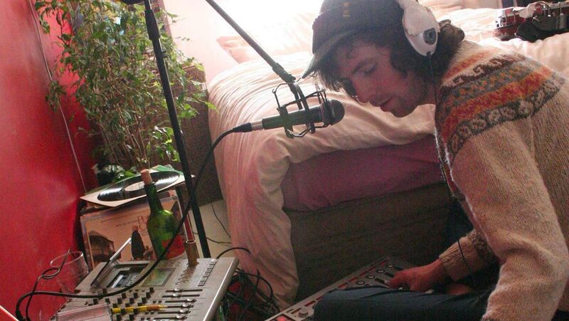 Simple Kid working on music in his bedroom studio. 