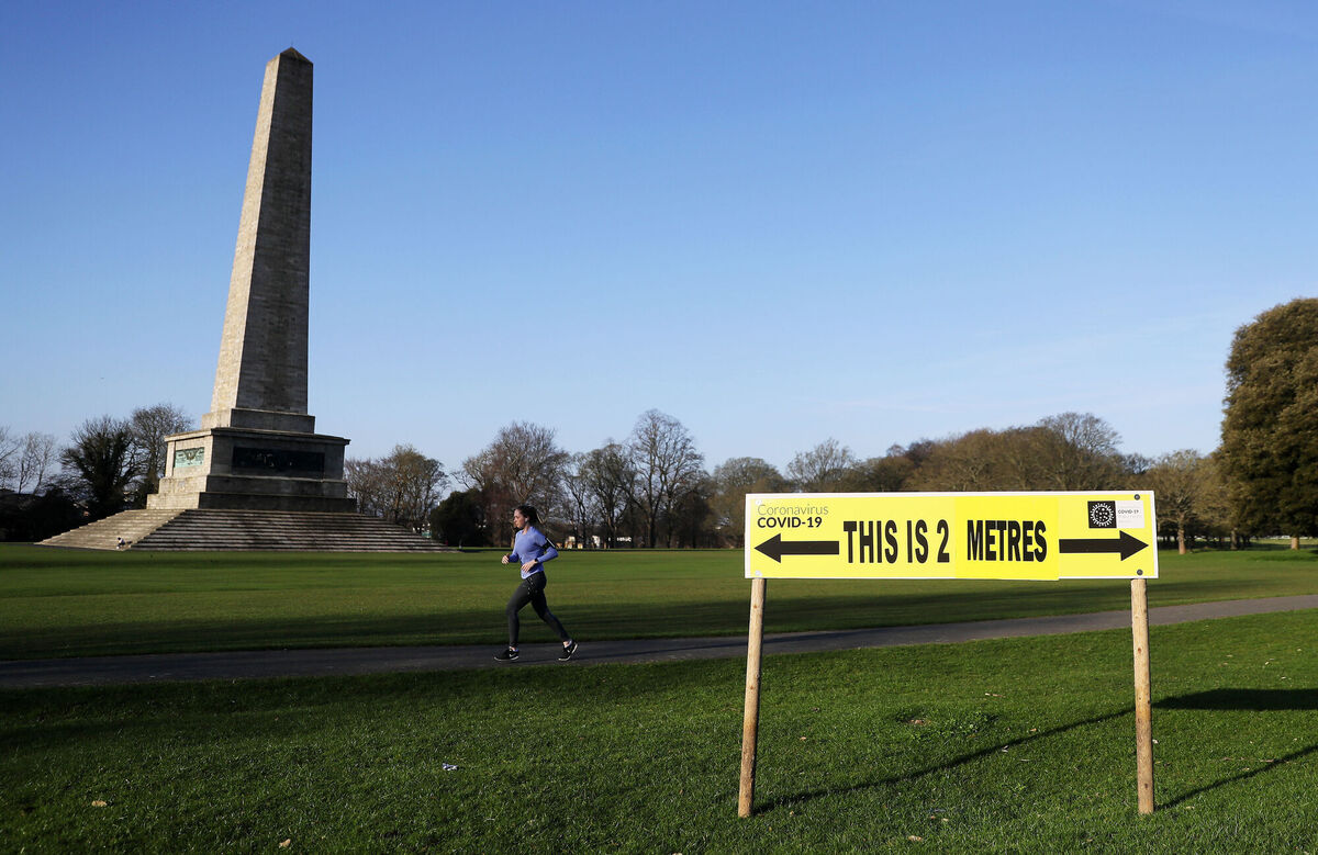 Social distancing signs remind people to keep well apart from others. Picture: Brian Lawless/PA Wire Social distancing signs remind people to keep well apart from others. Picture: Brian Lawless/PA Wire