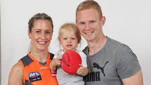<p>GIANT STEPS: Bríd Stack in her new club colours with husband Cárthach, and their son, Cárthach Óg, before her shocking injury.</p>