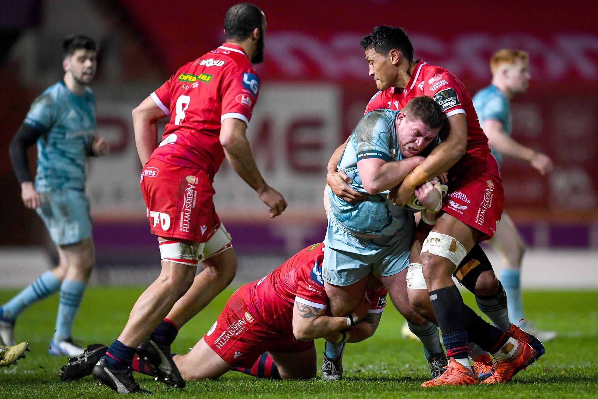 Leinster's Tadhg Furlong is tackled by Phil Price and Sam Lousi of Scarlets. Picture: INPHO/Ryan Hiscott