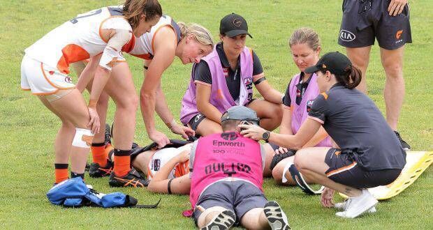 GWS Giants' Bríd Stack is attended to by medical staff.