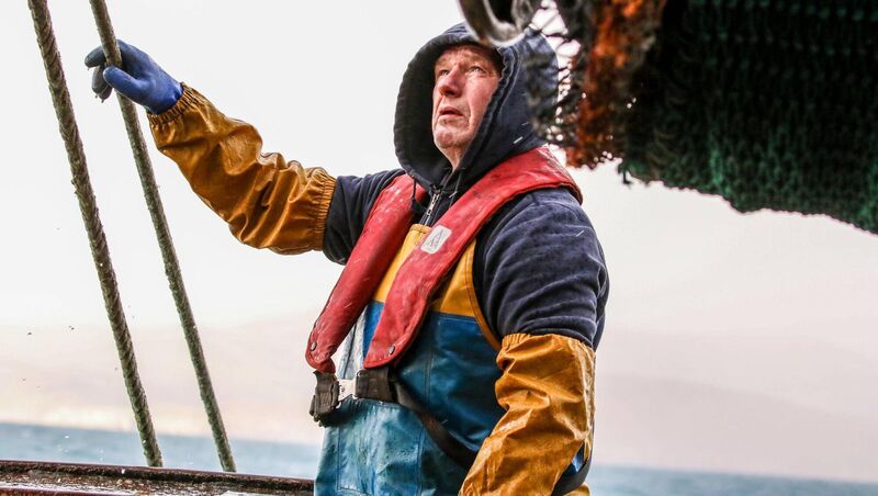Egidijus Maciulskis keeps a weather eye out from the deck of La Petite Edelweiss. On the bridge, Sean 'Bawn' O'Sullivan is also keeping an eye on the radar for other live vessels — he has previously had to avoid collisions with large ships being steered by less watchful navigators. 	Picture: Neil Michael