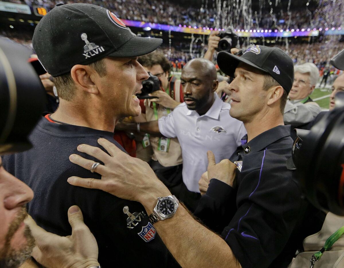 San Francisco 49ers head coach Jim Harbaugh, left, greets Baltimore Ravens head coach John Harbaugh after the Ravens defeated the 49ers 34-31 in Super Bowl XLVII in 2013. Picture: Dave Martin